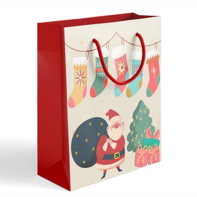 China Various Size Cartoon Santa Claus 2022 Handmade Design New In Stock Manufacturer Christmas Gift Paper Bags With Handles For Present for sale