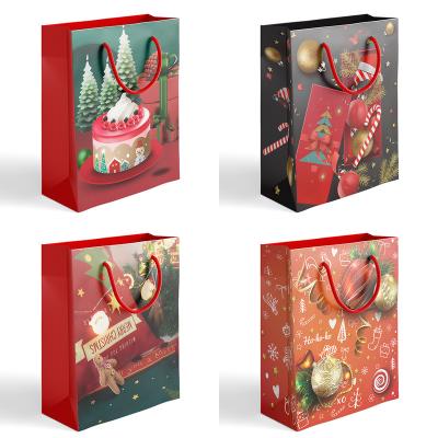 China 2022 New Design Merry Christmas Handmade Gift Paper Bag Packaging Paper Bag With Handles For Christmas Party for sale