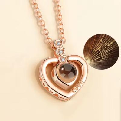 China TRENDY Free samples Different Languages I Love You Pendant Projection Necklace Wedding Valentine's Day Love Memory Projection Necklace for sale