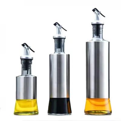 China Fashionable Empty Oil Glass Bottles Kitchen 200/350/500ml Cooking Olive Oil Glass Bottle With Metal Spout for sale