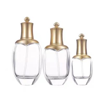 China Luxury Cosmetic Shape 40ml 100ml 120ml Lotion Bottle Designer Shape 40ml 100ml 120ml Clear Glass Lotion Pump Bottle for sale