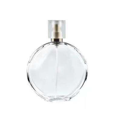 China Customized 50ml 100ml Perfume Glass Cosmetic Clear Round Bottle With Plastic Screw Cap for sale