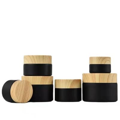 China New Customized Matte Cosmetic Cream Glass Bottles And Cosmetic Jars With Bamboo Lids for sale