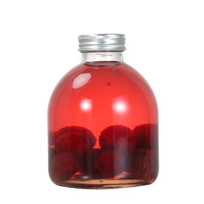 China New Design Beverage Big Belly Beverage Glass Bottle 300ml 500ml With Matel Lids for sale