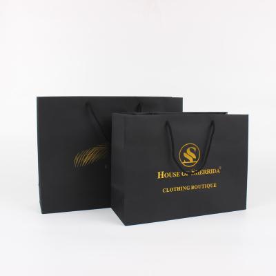 China Recycled Materials Luxury Custom Own Logo Bronzing UV Black Paper Bag Clothing Shopping Bag for sale