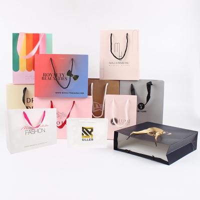 China Recycled Materials Store Luxury Personal Logo Printing Custom Paper Bags For Clothing Packaging Bags Shopping Paper Bags for sale