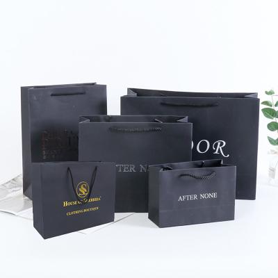 China Recycled materials wholesale gold foil custom LOGO logo gift bag shopping bag luxury black paper shopping bag for sale