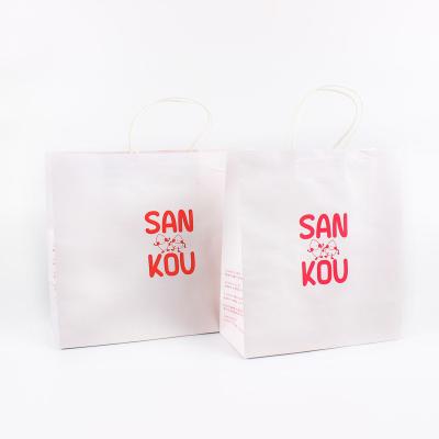 China Wholesale Luxury Custom White Cowhide Paper Bag Clothing Store Portable Shopping Bag Recyclable and Biodegradable for sale