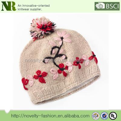 China 2017 New Design Women's COMMON Flower Embroidered Pom Pom Wool Beanie Hat With Fleece Lining for sale