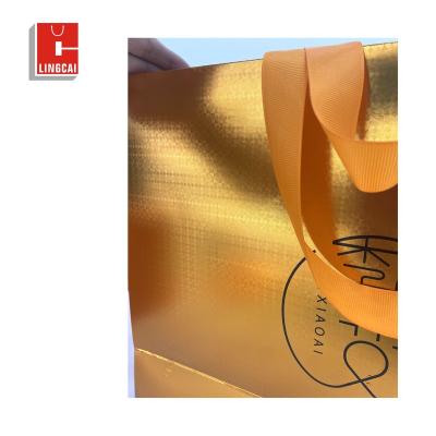 China Recyclable Custom Printed White Logo Gold Stamping Gift Paper Shopping Gift Bags With Handle For Christmas for sale