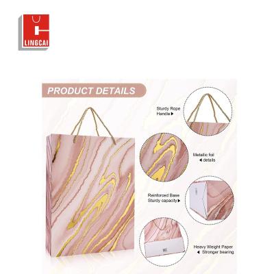 China Custom Recyclable Private Logo Pink Gold Offset Printing Personalized Tote Gift Paper Bags With Twine Rope Luxury Shopping Handles for sale