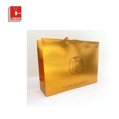 China Recyclable made in china custom printed white logo gold stamping gift paper shopping gift bags with handle for sale