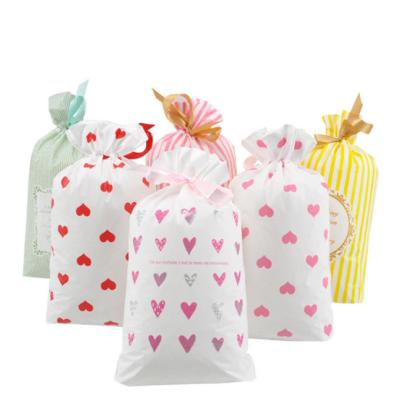 China Ribbon Drawstring Bag New Year Packaging Gift Bag Recyclable Candy Explosive Paper Bag for sale