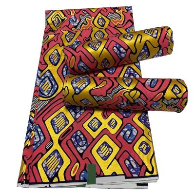 China Hot Selling Anti-Static Real African Wax Prints Yellow And Red Java Ankara Hollandaise Wax Cotton Fabric For Clothing for sale