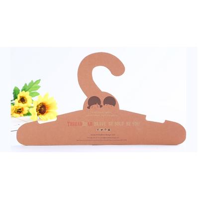 China Brand New Printing Recycled Space Save Kraft Paper Cardboard Hanger For Packaging for sale