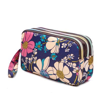 China Wholesale High Quality Fashionable Bag Design Women Wallet With Three Layer Zipper Large Capacity Floral Makeup Purses for sale