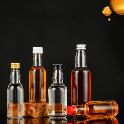 China 30ml 40ml 50ml 100ml Mini Small Sample Alcohol Juice Drinks Glass Wine Liquor Bottle with Screw Cap zu verkaufen