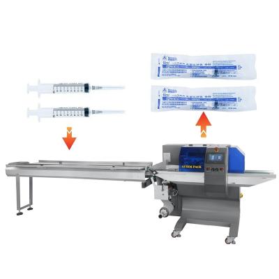 China Food Low price good quality wrapping machine automatic pillow flow packing machine sealing Medical Syringe Needle medical supplies for sale