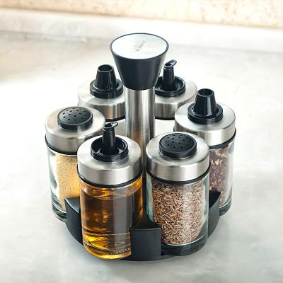 China Viable 7 Pcs Set Canned Storage Condiment Set Seasoning Rack And Spoon Seasoning Spice Jars Stainless Steel Glass Seasoning Bottle With Rack for sale