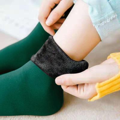 China Autumn and winter tube snow antibacterial adult warm socks and velvet thickening men and women shape solid color floor socks for sale