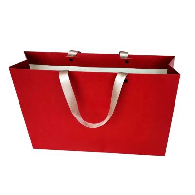 China Recyclable Custom Fashion Your Own Logo Print Clothing Bag Kraft Paper Cosmetics Gift Shopping Luxury Paper Bags With Handle for sale