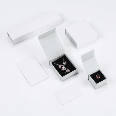 China Biodegradable Luxury Small White Magnet Custom Hardboard Logo Jewelry Packaging Box for sale