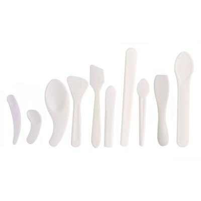 China Factory Mini Spatula Picosecond Eye Scoop Spatula Plastic Spoon Wholesale Cosmetic Cream Disposable White Spoon for sale