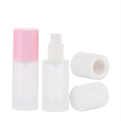 China New Base Glass Cosmetic Liquid Bottle With Custom Pump Spray Pink Around Bottom Cosmetic Bottle for sale