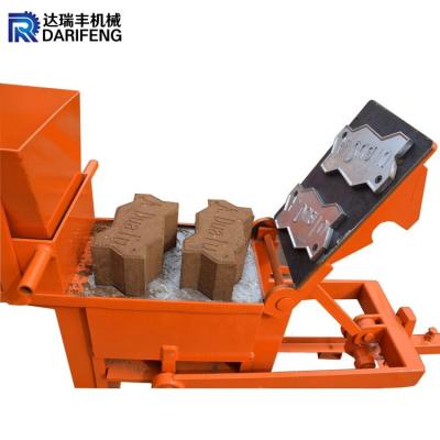 Cina QMR2-40 lowest price inter locking bricks machine soil red clay hollow block making machinery in vendita