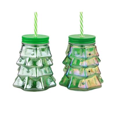 China Machine Made Drinking Glass Beverage Winter Tree Shape Mason Jar Green With Tin Lid And Plastic Straw for sale