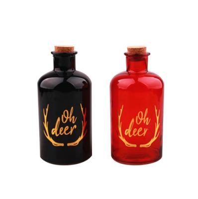 China New Design 550ml Viable Glass Bottle With Cork Lid Spray Decal Drink Bottle Machine Made for sale