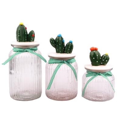 China Freshness Preservation 3 Size Glass Storage Canister With Cactus Shape Ceramic Lid for sale