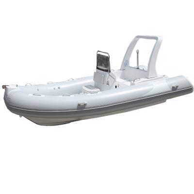 China Cheap and high quality PVC fiberglass inflatable boat with outboard motor for sale