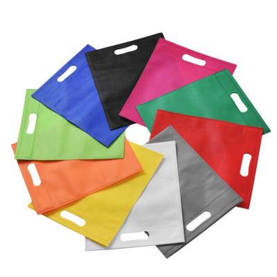 China Wholesale Customized Logo Red/Blue/Green/White/Grey/Black D Eco-Friendly Cut Nonwoven Bags For T Shirt for sale