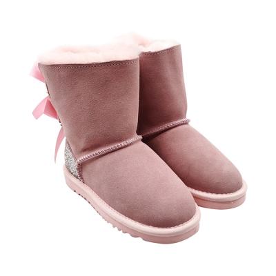 China Waterproof 2021 New Women's Integrated Snow Fur Boots Sheep Fur Manual Warm Diamond Bow Diamond Bow Bright Leather Plus Warm Velvet Boots. for sale