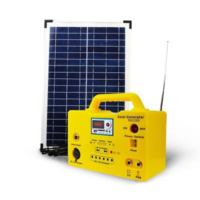 China generador solar portátil de iluminación solar SG1230 del reproductor Mp3 de la radio de 30W Kit Phone Power Charging FM en venta