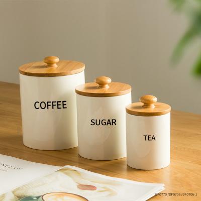 China Wholesale Custom Logo Ceramic Airtight Canister Multi-Size White Airtight Storage Jars Freshness Preservation With Wooden Lid for sale