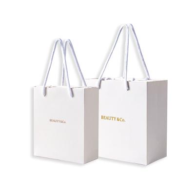 China Recycled Materials Paper Bag Manufacturers ReusablePackaging Wholesale Custom Luxury Shopping Bag Gift Bag for sale