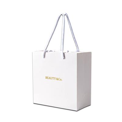 China Recyclable Personality Custom Printed Luxury Brand Retail Shopping Packaging Luxury Craft Paper Bags With Logo for sale