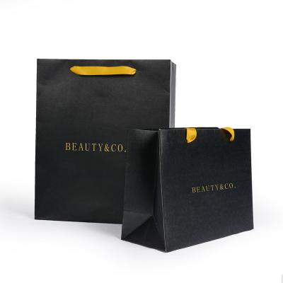 China Luxury Recycled Materials Ribbon Handle Boutique Shopping Packaging Customized Printed Black Gift Bags With Logo Ribbons for sale