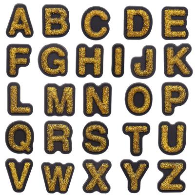 China Wholesale 10Pcs+ Soft Customize Golden Flash Shoe Charm Powder Letters Designer Shoe Decorations Kids Party Gift PVC for sale