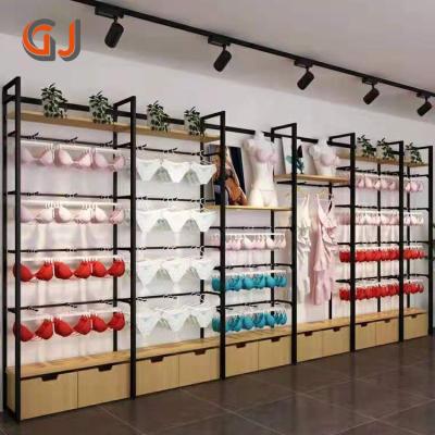 China Corrosion Protection Miniso Cosmetics Shop Pet Stationery Shelf Underwear Clothing Store Furniture Design Display Stand Mobile Rack for sale