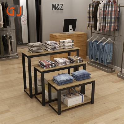 China Customized morden or fashion garment store display rack retail clothing store table front desk for sale