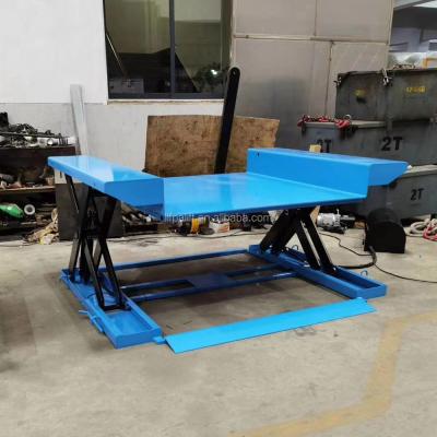 China Building Material Shops 1000kg Electric Scissor Lift Platforms Powered Hydraulic Ground Table for sale