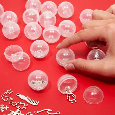 China Small Toys Package Inside 1.1 Inch Small Round Capsules Bulk Containers PP Material Clear For Gumball Tools Surprise For Kids Gift for sale