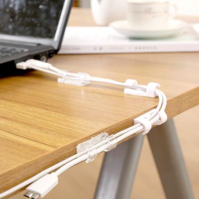 China Durable Strong Adhesive Plastic Organizers Desktop Cable Holder Black USB Fill Lines Cables White Cable Winder Cord Management Clips for sale