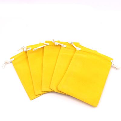 China Recyclable 50pcs/lot Wholesale Single Style Yellow Multi-size Good Convenient Jewelry Packaging Bag Knit Velvet Bag Can Custom Logo for sale