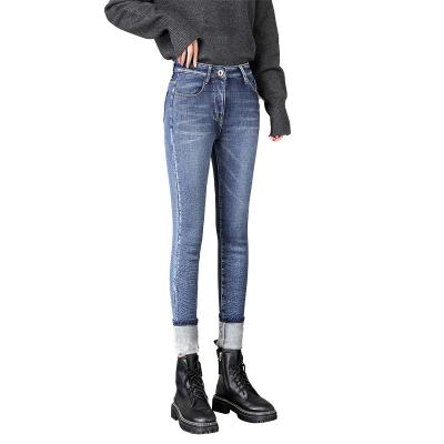 China Waterproof Tight Women's Jeans Pants Winter Velvet Fleece Thick Warm Jeans Pants for sale