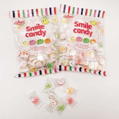 China Hot Sale Low Sugar Sugar Free Sweets 2 In 1 Double Layer Fruit Flavors Tablet Smile Candy for sale