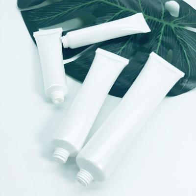 China Cosmetics Cream Stock Empty Cosmetic Squeeze White Plastic Soft Tubes With Screw On Cap for sale